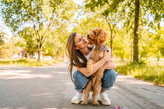 woman hugging dog on oakfield lakes trail