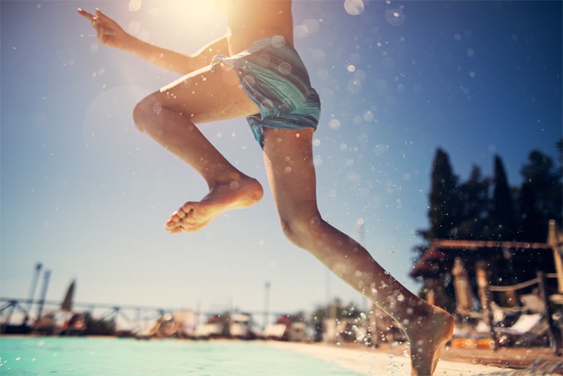 kid jumping in a pool at oakfields community center