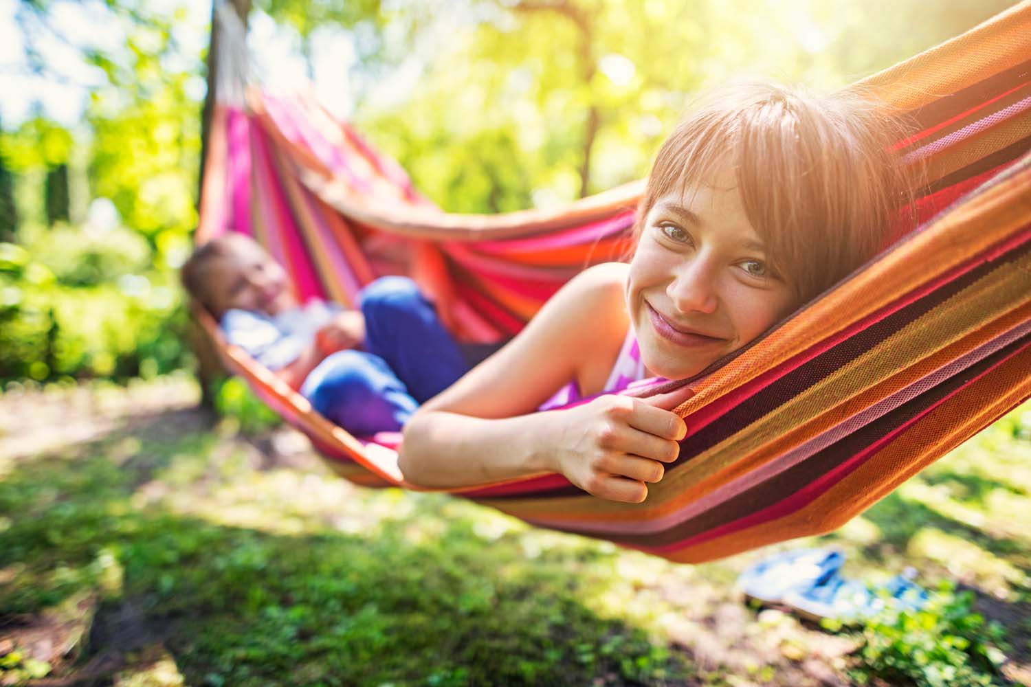 brother and sister in a hammock in oakfields nature trails