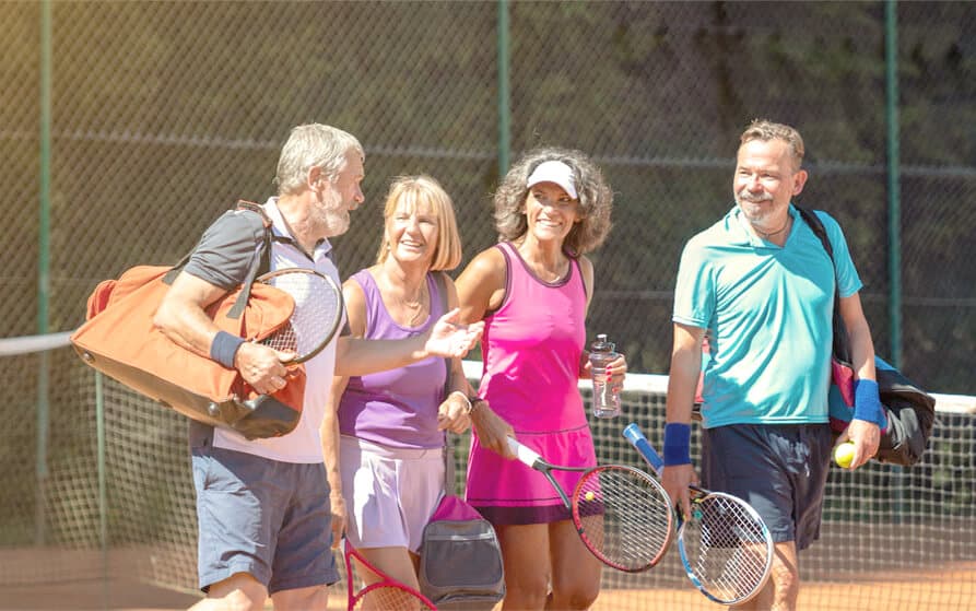 two couples playing Pickleball at Oakfield Trails