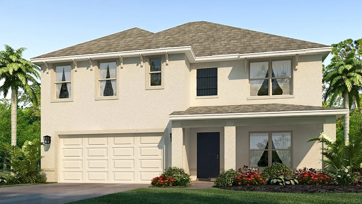 A two-story modern suburban house with a light-colored exterior, double garage, and neatly landscaped front yard with flowers and palm trees, viewed on a sunny day.