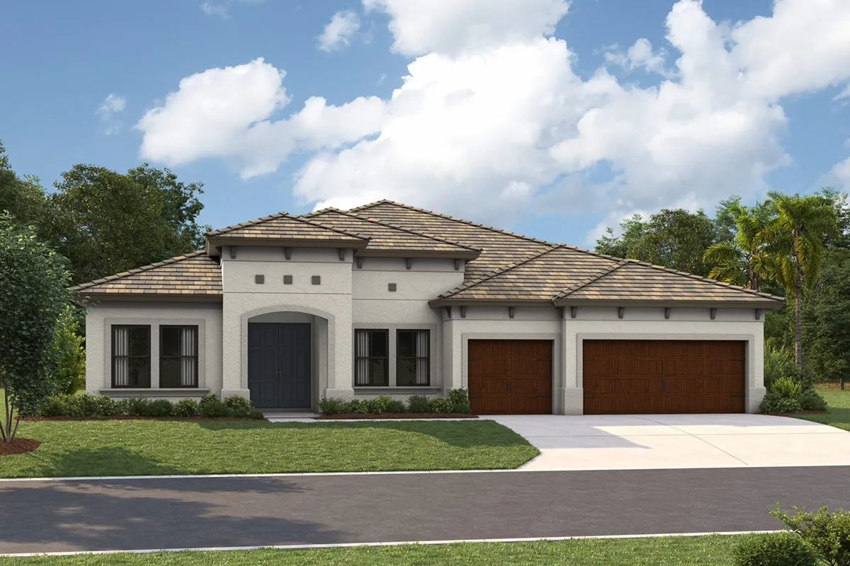 A modern single-story house with a light-colored exterior, arched entryway, three-car garage with wooden doors, neatly trimmed lawn, and trees in the background under a partly cloudy sky.