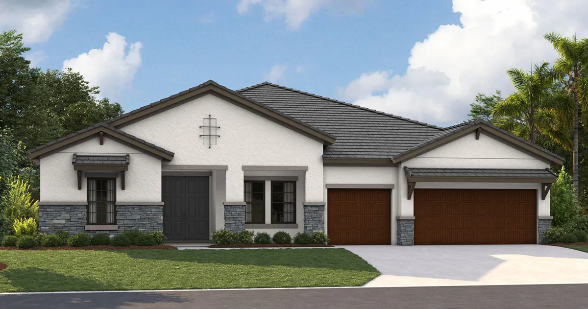 Single-story modern house with a gray tile roof, white and gray exterior, three brown garage doors, black front door, stone accents, and landscaped front yard with grass and small shrubs. Blue sky with clouds in the background.