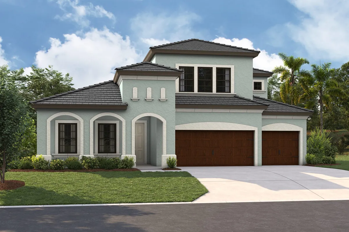 Two-story modern suburban house with light blue walls, white trim, dark gray tile roof, and three wooden garage doors. The front yard is landscaped with green grass, shrubs, and trees, under a partly cloudy sky.