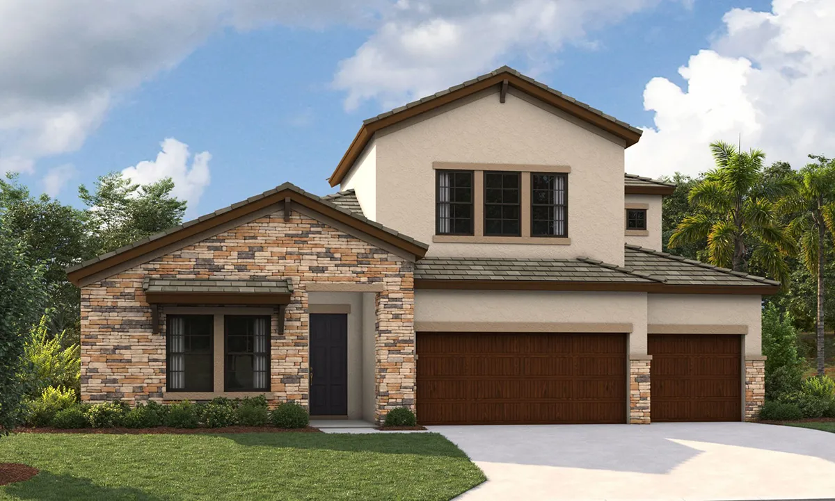A modern two-story house with light-colored stucco and stone accents, brown trim, and a three-car garage. The home has a neatly manicured lawn, shrubbery, and is set against a partly cloudy sky with trees in the background.