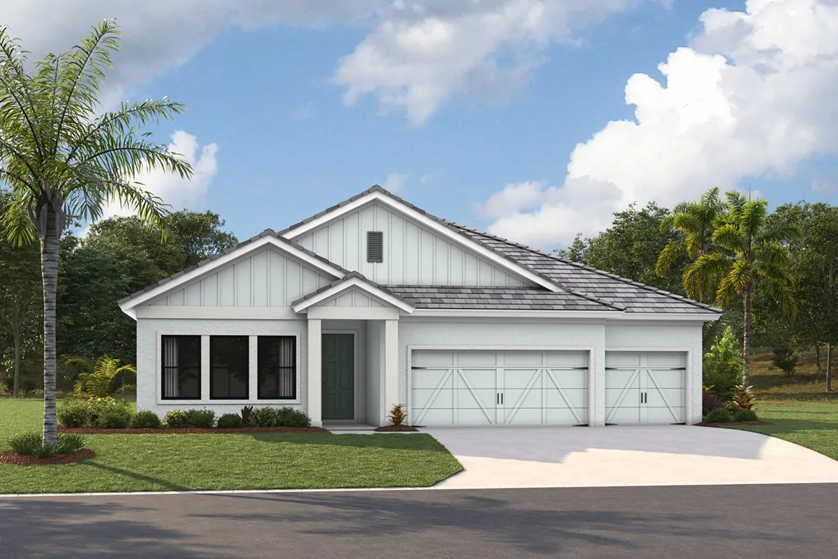 A modern single-story white house with a gray roof, double garage doors, large windows, and a well-maintained green lawn. Palm trees and bushes are in the yard, and the sky is partly cloudy.