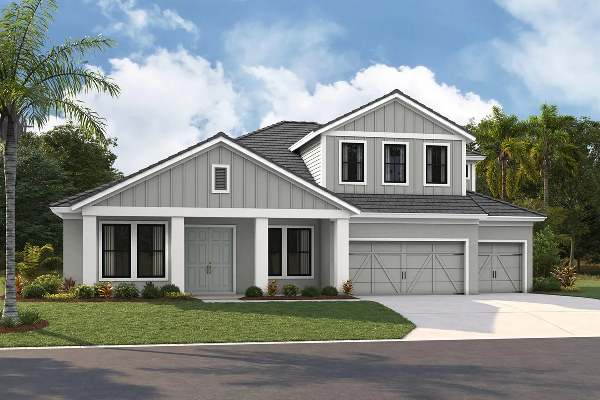Modern two-story house with gray siding, white trim, double front doors, three front-facing windows upstairs, two-car garage, and a neatly landscaped lawn with palm trees under a blue sky with clouds.