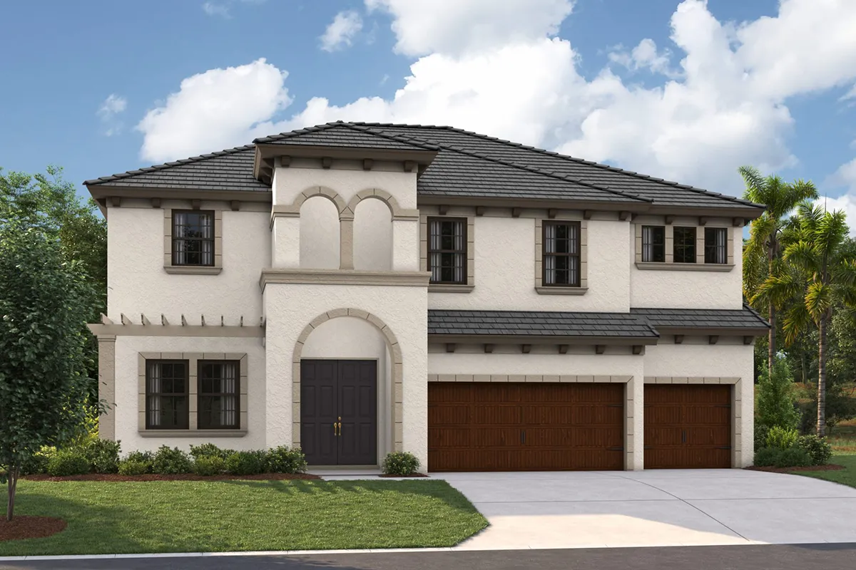 Two-story modern Mediterranean-style house with cream stucco walls, dark roof tiles, arched entryway, large windows, and a three-car wooden garage. The driveway and small landscaped front yard are visible under a partly cloudy sky.