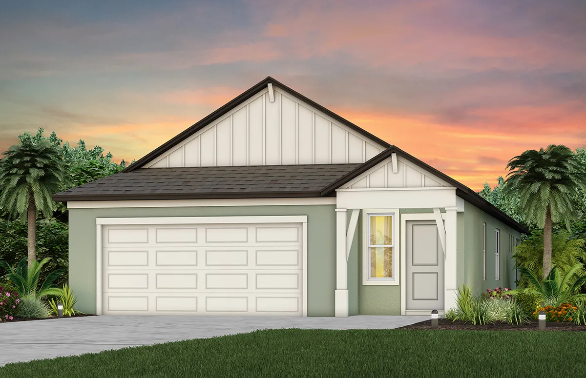 Single-story, light-green house with a white garage door, gable roof, and front porch, surrounded by palm trees and lush landscaping, set against a colorful sunset sky.