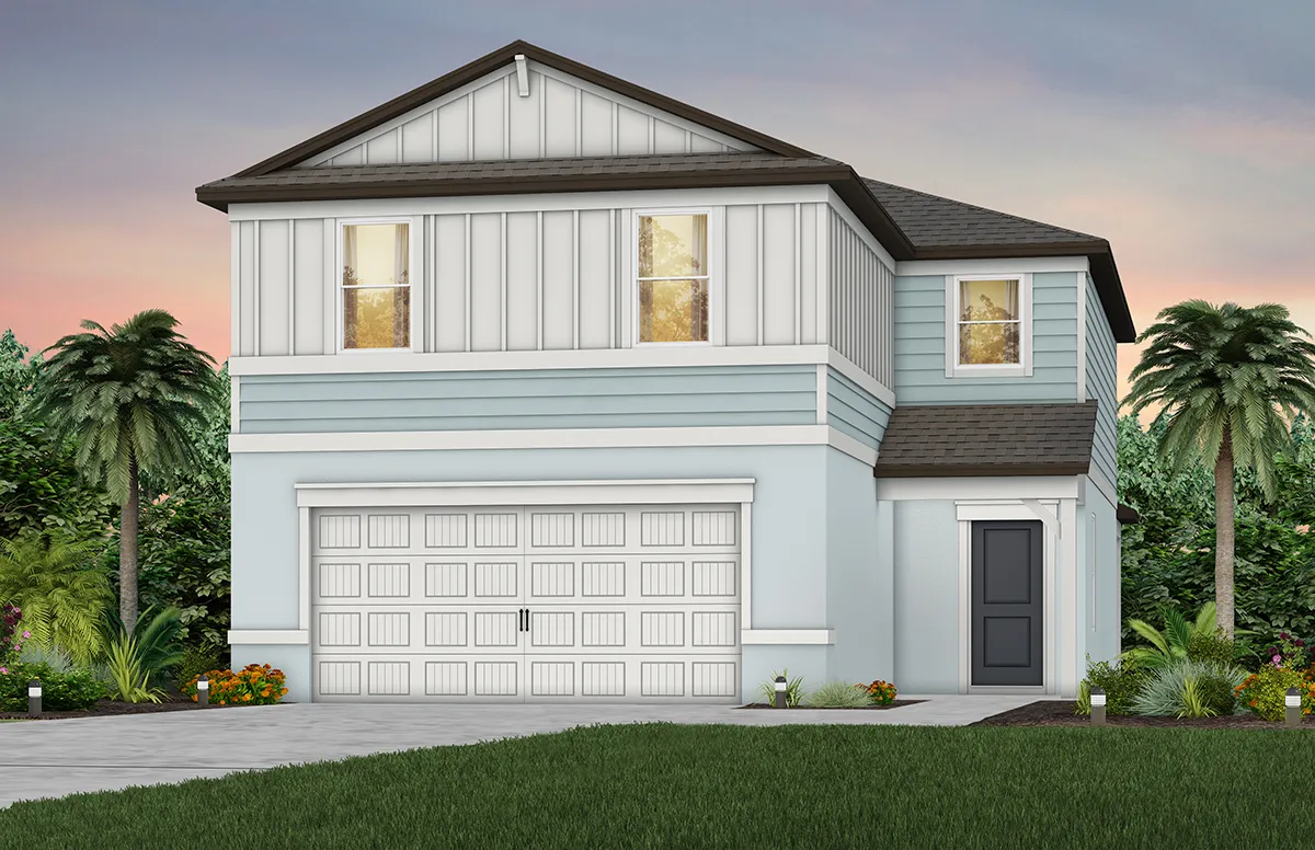 A modern two-story light blue house with white trim, a double garage door, dark gray front door, and large windows. The front yard has green grass, small shrubs, flowers, and palm trees in the background at sunset.