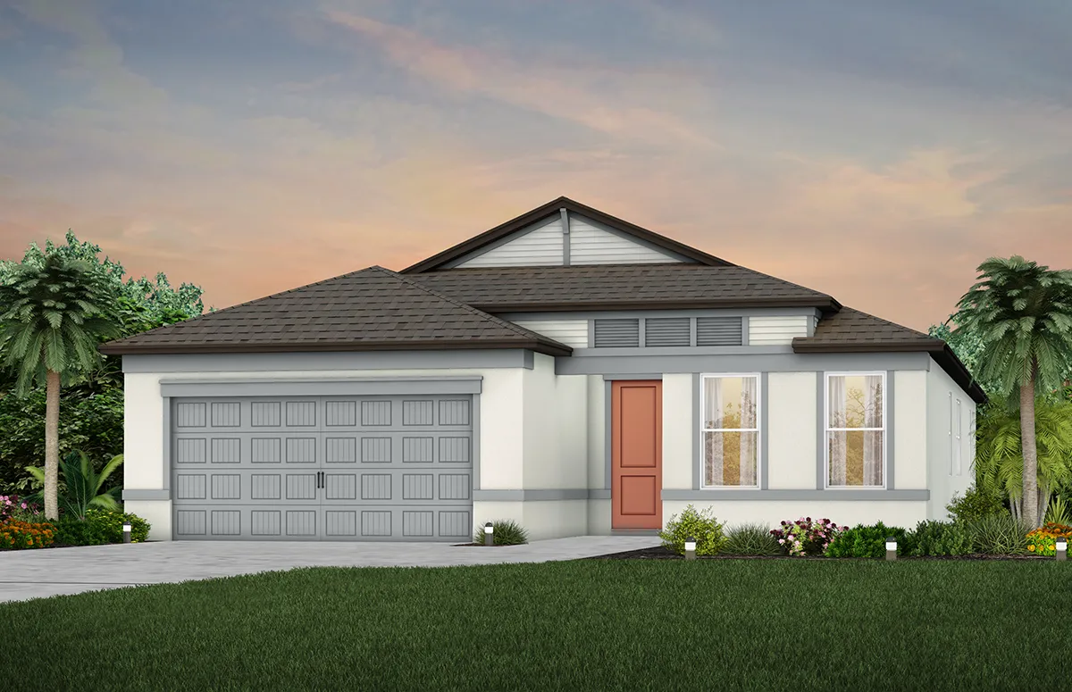 A modern single-story house with a gray roof, white exterior, large front windows, a red front door, and an attached two-car garage. The yard has green grass, palm trees, and colorful flowers, under a sunset sky.