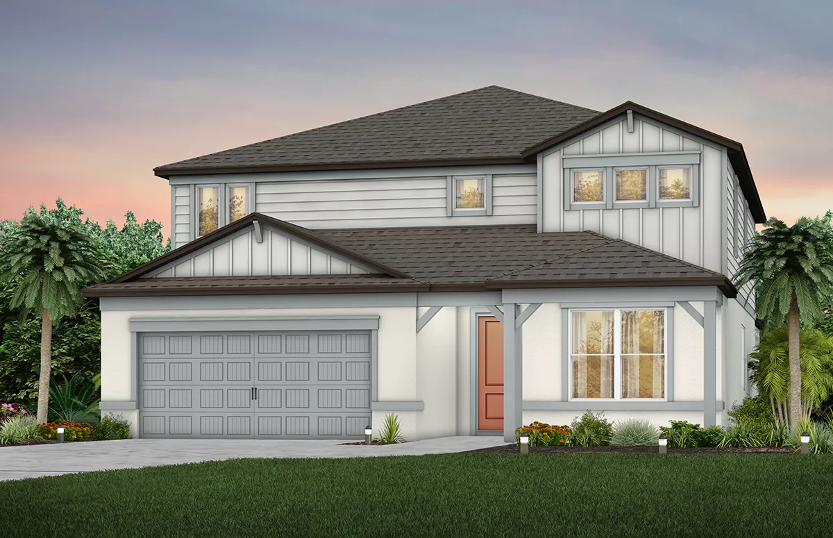 A two-story modern suburban house with gray siding, a dark gray roof, a double garage, and a red front door, surrounded by green lawn, small shrubs, and palm trees at sunset.