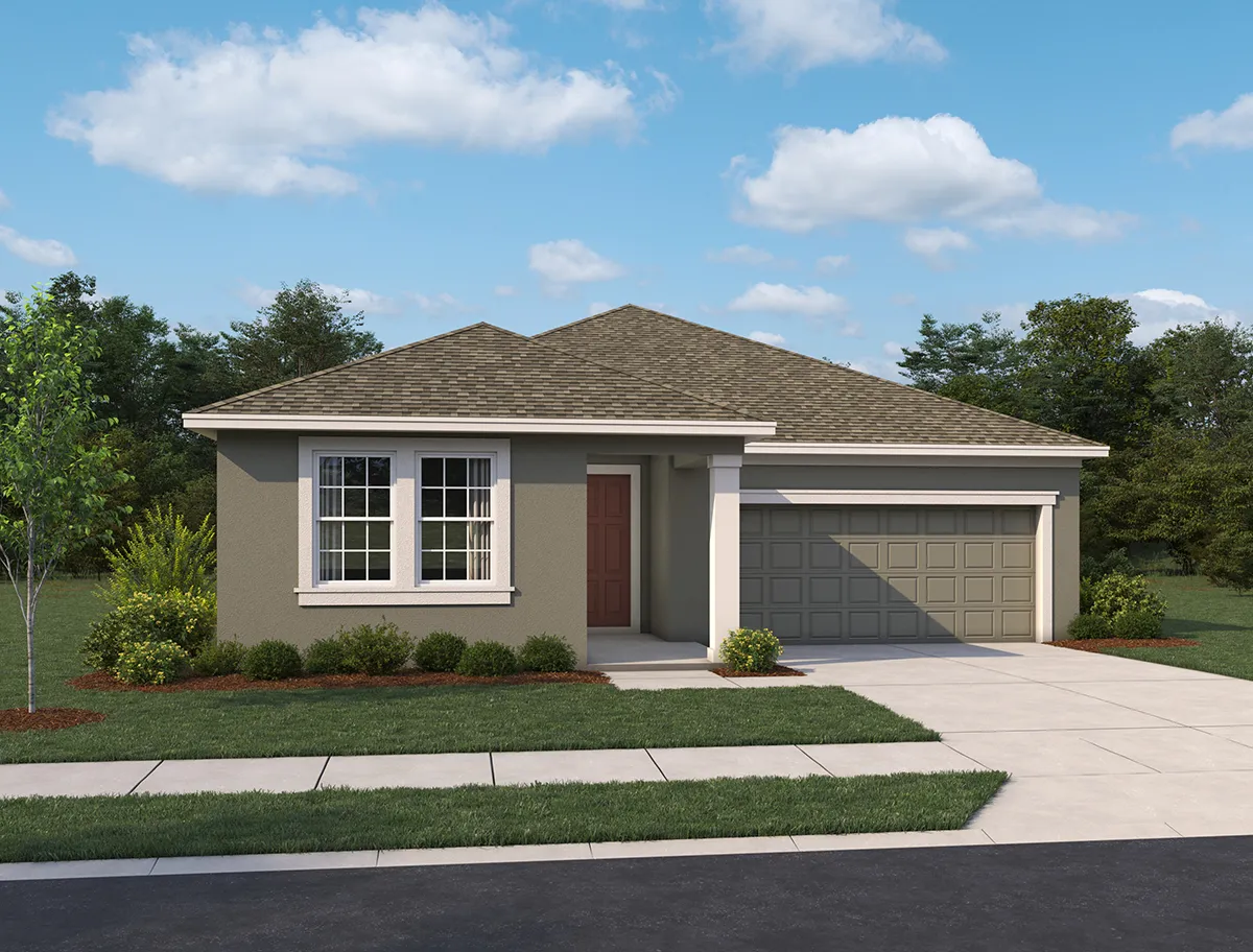 Single-story house with a gray exterior, brown front door, two-car garage, and neatly landscaped yard, set against a blue sky with scattered clouds and trees in the background.