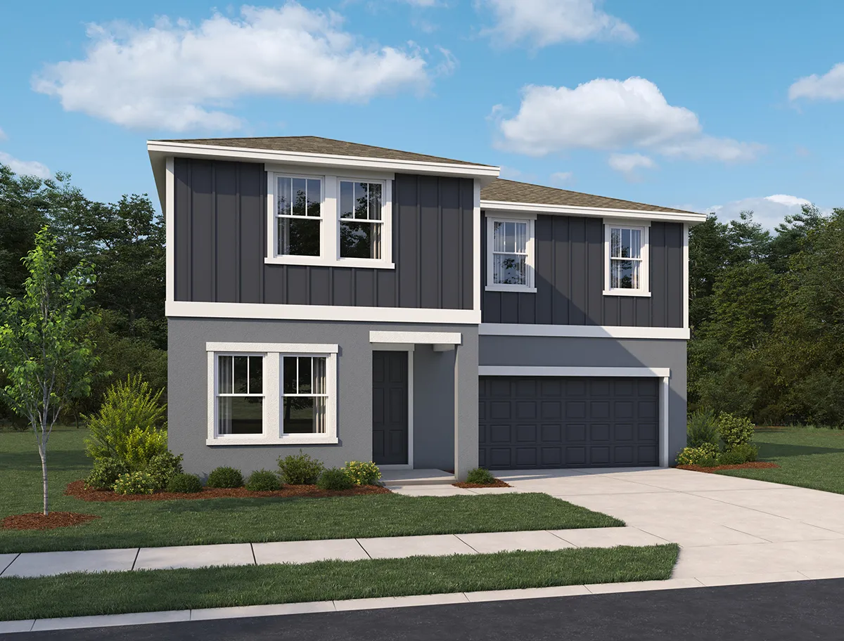 Modern two-story house with gray and white exterior, large windows, double garage, landscaped front yard with bushes and a small tree, set against a backdrop of greenery and blue sky with scattered clouds.