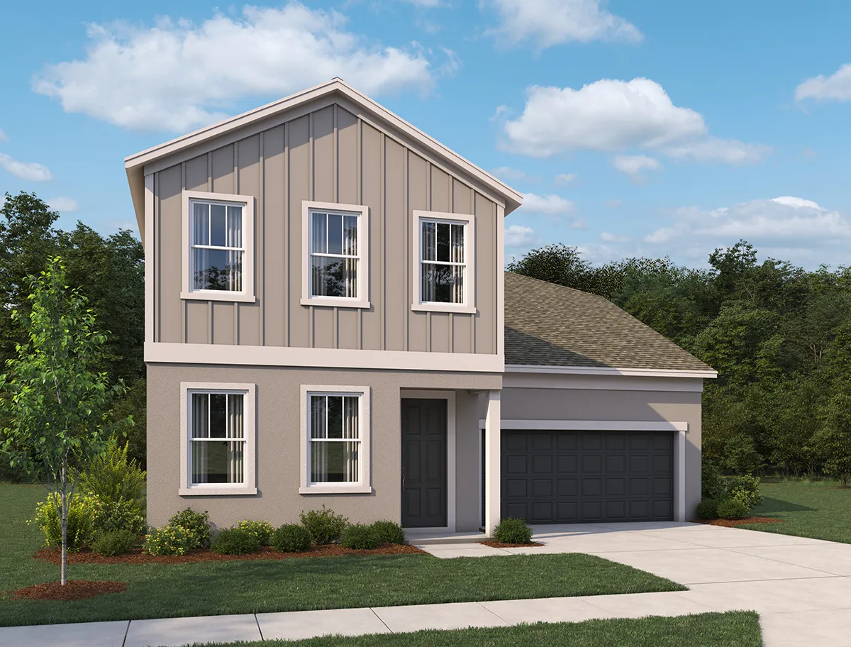 Two-story modern suburban house with beige and taupe siding, four upper windows, three lower windows, a dark front door, and a two-car garage. The house is landscaped with grass, bushes, and a small tree.
