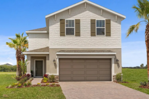 A two-story beige house with brown shutters and a double garage is shown with a paved driveway, front porch, manicured lawn, small shrubs, and palm trees under a clear blue sky.